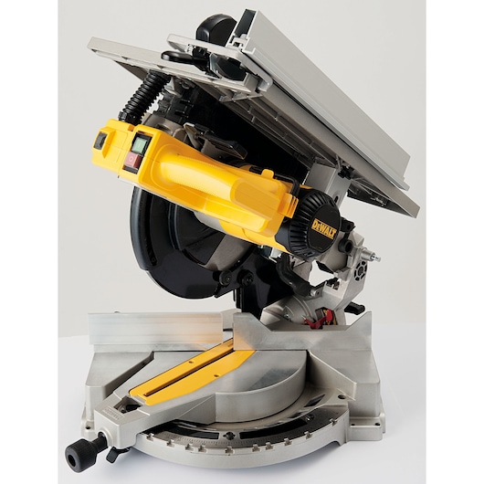 A DEWALT D27113 compound mitre saw with a yellow handle and a silver base. The saw is set in a tilted position, showing the blade, angle adjustment, and cutting platform.