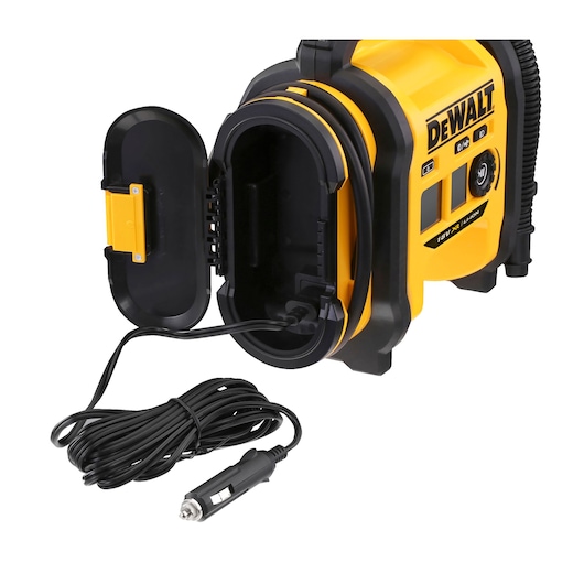A yellow and black DEWALT portable air compressor with an open compartment showing a storage area for the power cable and a car adapter plug.