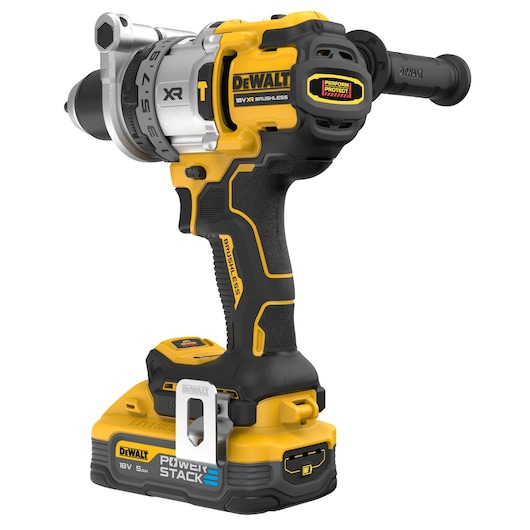A DEWALT 18V XR brushless cordless drill with a black and yellow design, featuring a PowerStack 5Ah battery attached, ergonomic grip, and side handle.