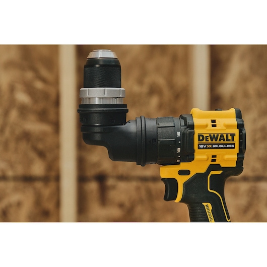 Close-up of a DEWALT 18V XR Brushless cordless drill with an angled attachment, shown against a wooden background.