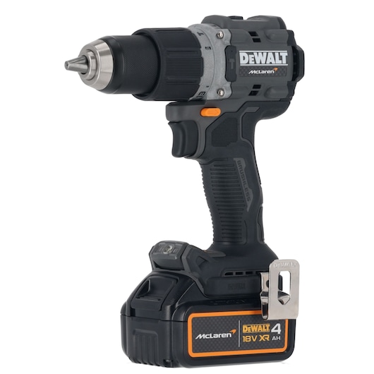A DEWALT cordless drill with brushless motor, featuring a black and silver design with orange accents. The drill is equipped with an 18V XR lithium-ion battery and has a McLaren branding on the battery and body.