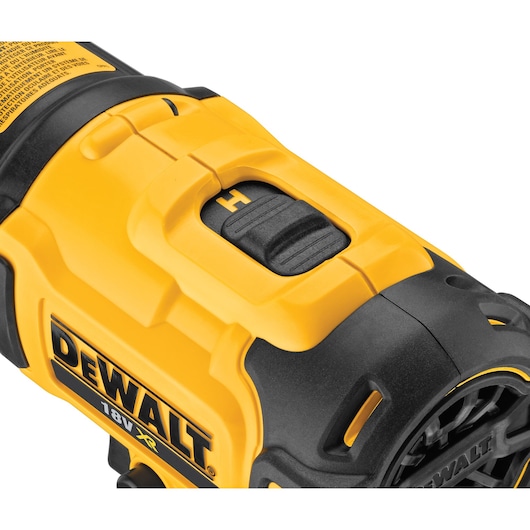 Close-up view of a yellow and black DEWALT 18V XR cordless tool, showing the switch and part of the label.