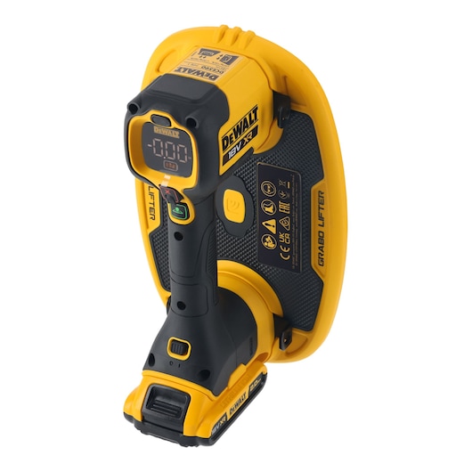 A yellow and black DEWALT 18V XR powered vacuum lifter tool, labeled 'GRABO LIFTER', featuring a digital display screen and ergonomic handle. The tool is designed for securely lifting and handling smooth, non-porous materials.