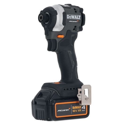 A DEWALT McLaren 18V XR cordless impact driver with a 4 Ah battery, shown upright with a side clip attached.