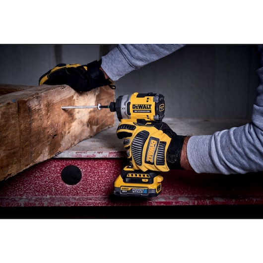 DEWALT DCF860N-XJ, DCF860N impact driver in use, driving screw into wood. Product photography.