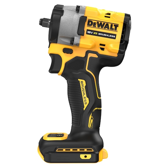 A DEWALT 18V XR brushless cordless impact wrench in yellow and black, shown in a side view with the battery compartment visible.