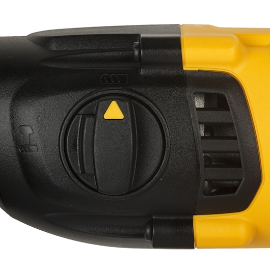 Close-up view of a DEWALT rotary hammer drill mode selector dial, featuring a black and yellow design with mode icons visible on the casing.