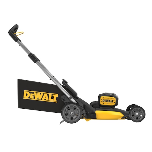 Side view of a DEWALT cordless lawn mower with a black and yellow color scheme, showing the large rear grass collection bag and robust wheels.