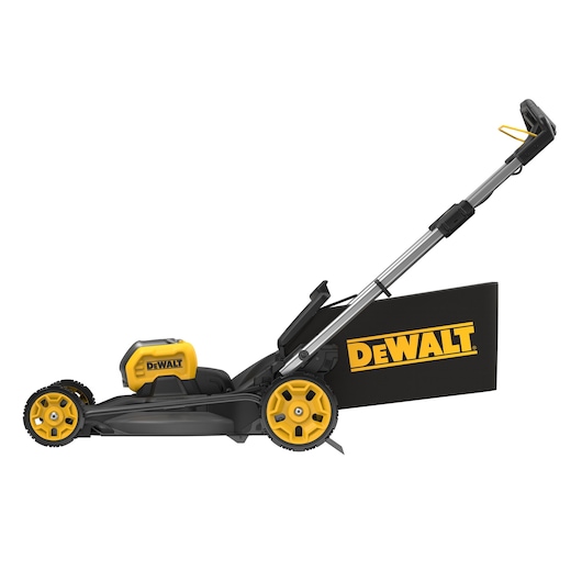 A DEWALT cordless lawn mower with yellow and black color scheme, shown from the side. The mower features a grass collection bag with the DEWALT logo and an ergonomic handle.