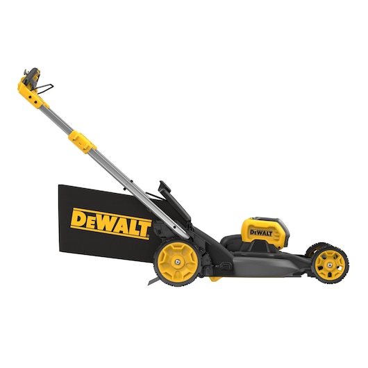 Side view of a DEWALT cordless electric lawn mower with yellow and black color scheme, large wheels, and a grass collection bag attached.