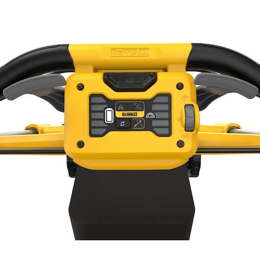 Close-up view of the control panel and handle of a DEWALT lawn mower, featuring buttons, a display, and labeled functions in yellow and black.