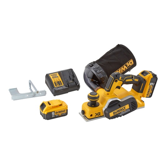 DEWALT cordless planer kit with yellow and black planer, dust bag, battery charger, two 18V XR Li-Ion batteries, and metal guide, shown on a white background.