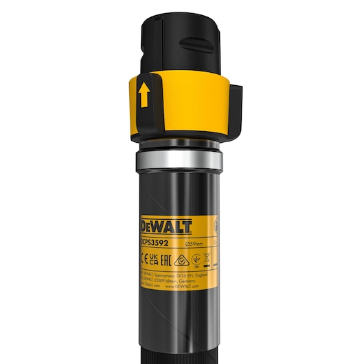 Close-up view of the DEWALT DCPS3592 tool component, featuring a cylindrical black and yellow body with product labeling and a yellow directional arrow on the attachment section.