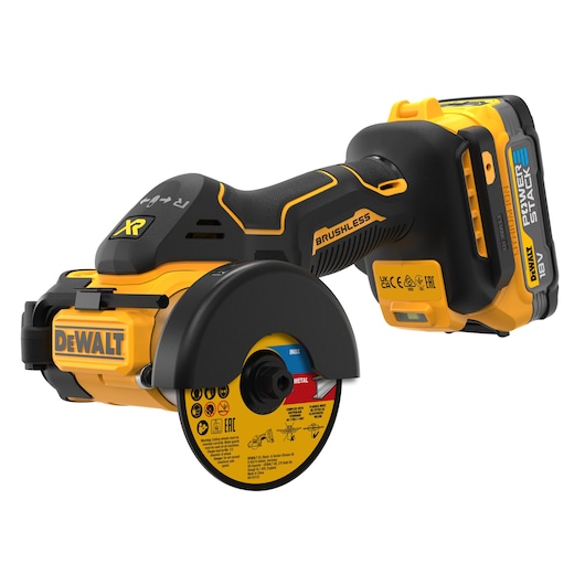 A close-up image of a DEWALT DCS438E2T cordless brushless power cutter with an 18V POWERSTACK battery. The tool is yellow and black and features safety labeling and a protective guard around the cutting disc.