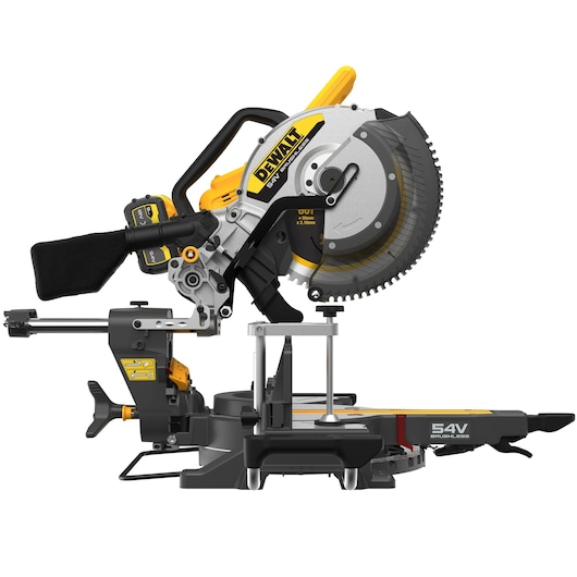 Side view of a DEWALT DCS781X2 54V brushless sliding compound miter saw, featuring a large circular saw blade, dust collection bag, adjustable handle, and rails for precise cutting. The tool is designed for professional woodworking and construction tasks.