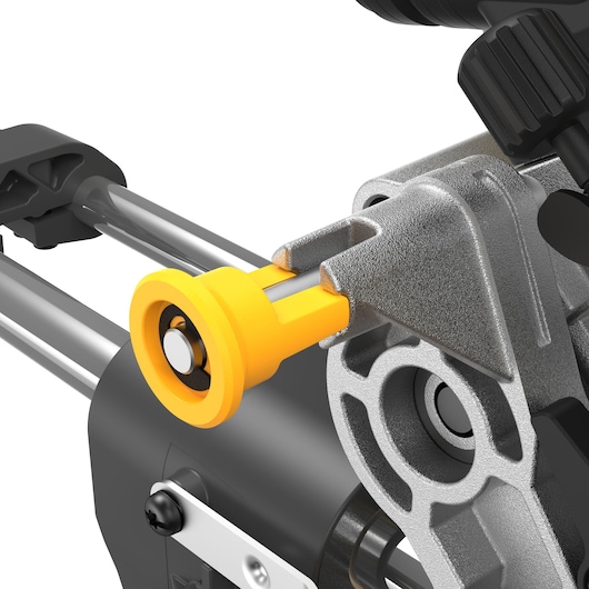 Close-up image of a DEWALT DCS781X2 power tool component, showing a yellow knob attached to a metallic mechanism with cylindrical rods.
