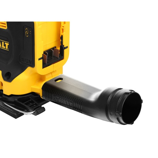 Close-up of a DEWALT power tool, showing the battery compartment and a black dust extraction attachment connected to the yellow and black tool body.