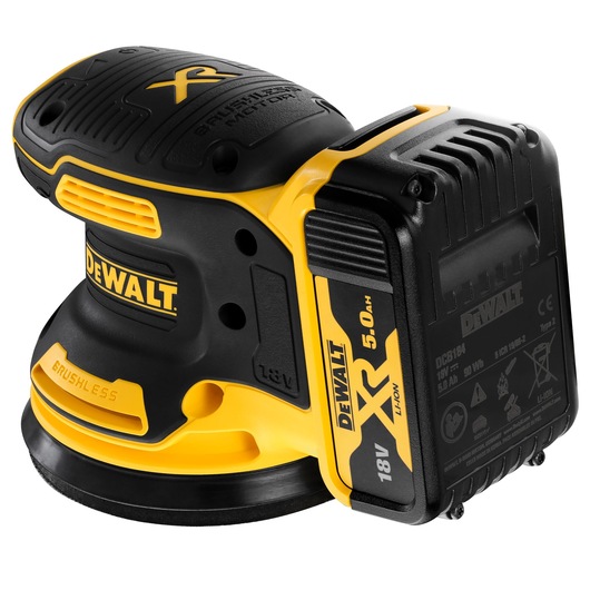 A close-up image of a DEWALT cordless random orbital sander, model DCW210P2, featuring a brushless motor and a detachable 18V XR 5.0Ah lithium-ion battery. The sander is mainly black and yellow in color.