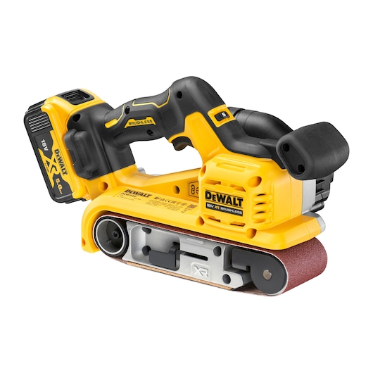 A DEWALT 18V XR brushless cordless belt sander with a black handle, yellow body, and attached battery pack. The sanding belt is visible on the bottom, and the DEWALT branding is clearly shown on the side.