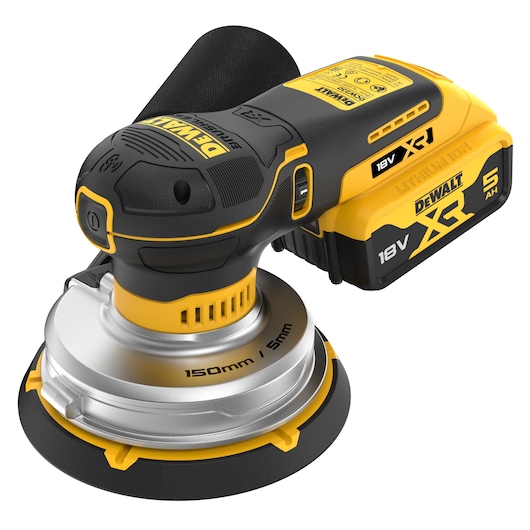 Cordless DEWALT 18V XR sander with 150mm pad and dust bag, shown in yellow and black close-up.