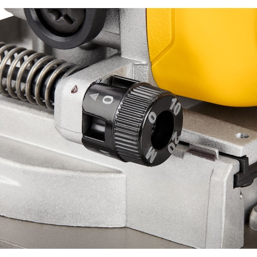 Close-up view of a DEWALT tool adjustment knob showing numbered settings from 0 to 20, attached to a metallic spring mechanism.
