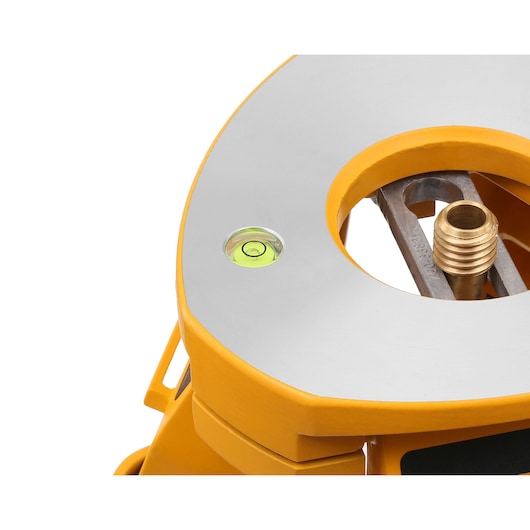 Close-up view of a DEWALT photography accessory, featuring a yellow and silver surface with a built-in bubble level and a threaded metal insert.