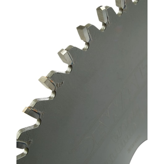 Close-up view of the teeth on a DEWALT circular saw blade, showing its sharp edges and metal surface.