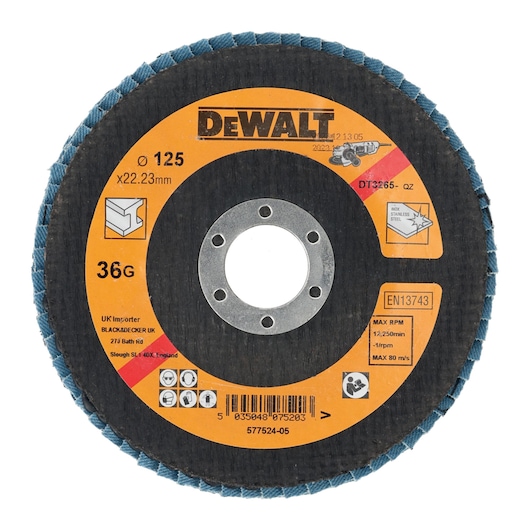 A DEWALT DT3265 abrasive flap disc with a diameter of 125mm and bore size of 22.23mm. The disc displays information including grit size (36G), maximum rpm (12,250), and suitable for stainless steel and metal grinding applications. The disc is black with a yellow label containing instructions, specifications, safety symbols, and manufacturer details.