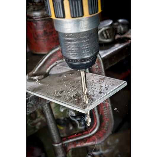 DEWALT DT4920-QZ, DT4920 drill bit in action on metal surface. Photography product category.