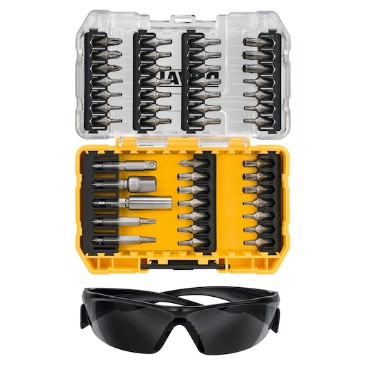 A DEWALT tool set including a yellow and transparent plastic case containing multiple screwdriver bits and accessories, shown open, with a pair of black protective safety glasses placed below the case.