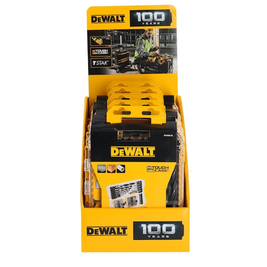 Front view of a DEWALT display stand featuring several DEWALT Tough Case tool kits with yellow handles. The stand celebrates 100 years of DEWALT and has product images and branding prominently shown.
