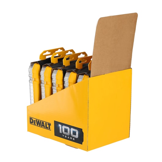 A yellow DEWALT branded cardboard display box containing several transparent and black plastic product cases with yellow accents, celebrating 100 years.