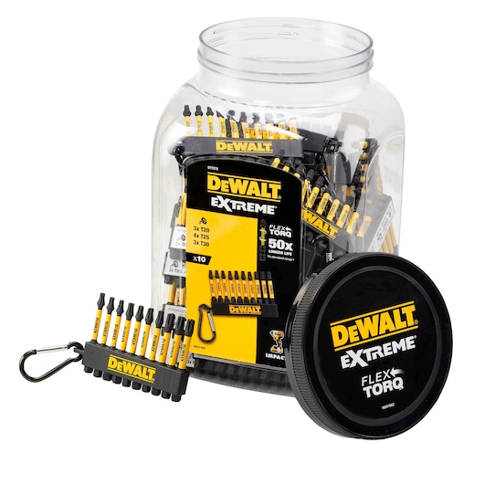 A clear plastic jar containing multiple DEWALT Extreme FlexTorq screwdriver bit sets. One bit holder with ten bits and a DEWALT-branded carabiner is placed in front of the jar. The jar lid displays DEWALT Extreme FlexTorq branding in yellow and white on a black background.