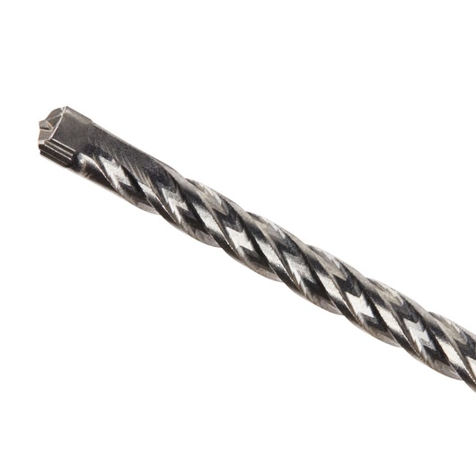 Close-up of a DEWALT DT8918 masonry drill bit with a spiral flute and carbide tip, designed for drilling into concrete or stone surfaces.