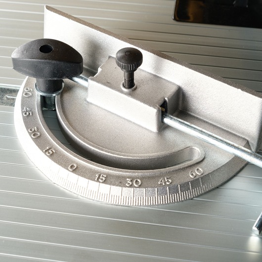 Close-up image of a metal miter gauge used for precise angular measurements on a table saw.