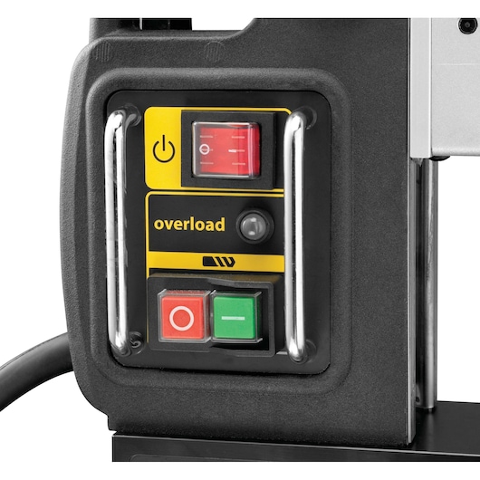 Close-up view of a DEWALT tool control panel featuring power switches, overload indicator, and protective metal bars.