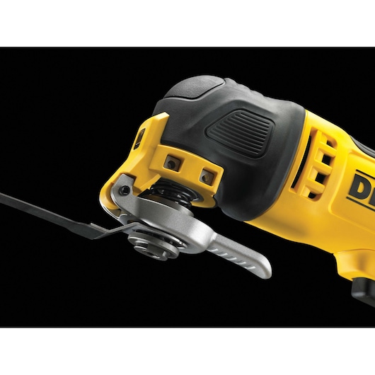 Close-up view of a DEWALT DWE315 oscillating multi-tool, showing the blade attachment and part of the yellow and black handle against a black background.