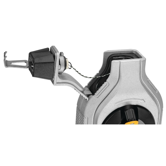 Close-up of a DEWALT chalk reel tool with the cover open, showing the internal mechanism and chalk line.