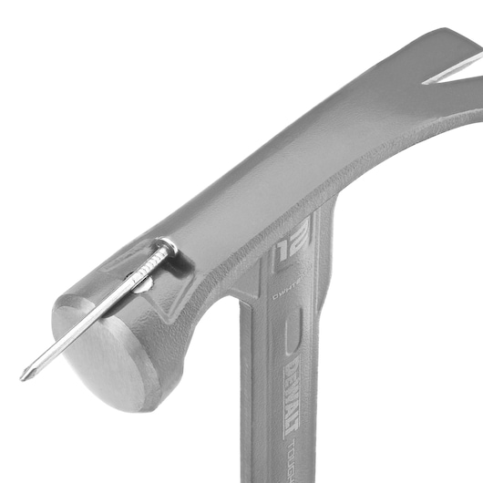 Close-up view of a DEWALT hammer, model DWHT51135-0, showing the head of the hammer holding a nail in a magnetic groove.