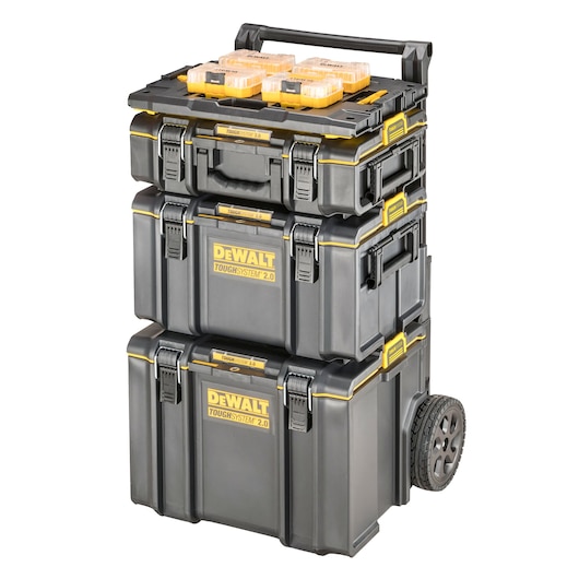 A stack of three black and yellow DEWALT ToughSystem 2.0 tool storage boxes on a wheeled cart, with two small transparent storage cases placed on top.