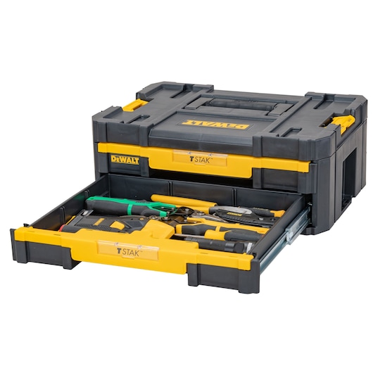 A DEWALT TSTAK tool storage box with a drawer partially open, containing various hand tools such as pliers, screwdrivers, and a drill.