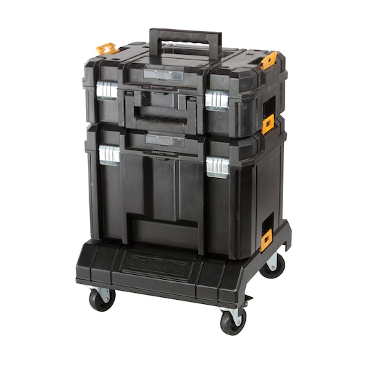 A black DEWALT stackable tool storage system with three compartments, orange latches, and silver hinges, all mounted on a wheeled base for easy transportation.