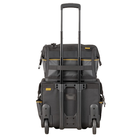 A DEWALT black rolling tool bag with a telescopic handle, external pockets, and sturdy wheels. The bag is stacked with an additional smaller tool bag attached on top.