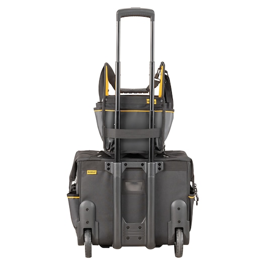 A DEWALT branded rolling tool bag with telescopic handle and an additional smaller tool bag stacked on top, both in black with yellow accents, designed for transporting and organizing tools.