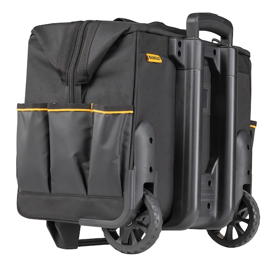 DEWALT black rolling tool bag with a hard plastic base, large wheels, a telescopic handle, and external pockets for tools.