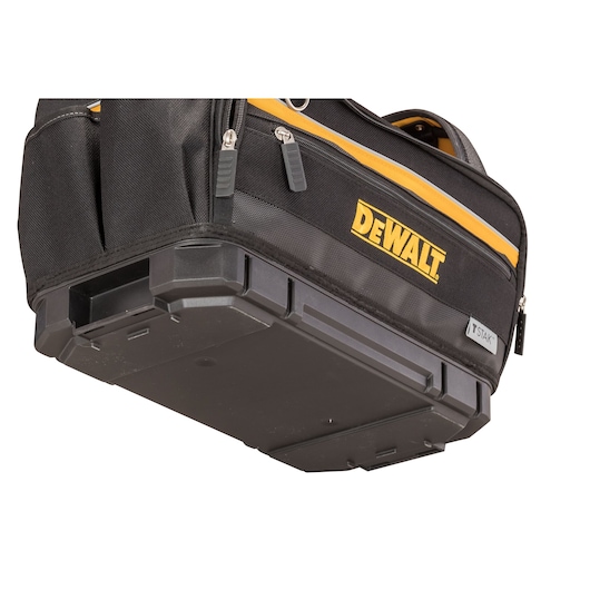 Close-up view of a DEWALT branded black tool storage bag with a durable hard plastic base, yellow accent, zipped compartments, and T STAK label.