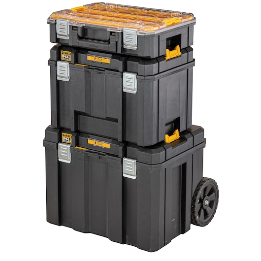 Stack of three black DEWALT TSTAK modular storage boxes, with yellow and silver latches, including a wheeled base unit and a clear lid on the top box.