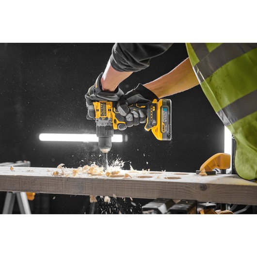 18V XR Brushless Hammer Drill Driver right side view drilling down on wood